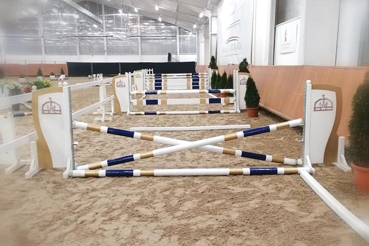 Horse jump obstacles in an indoor equestrian arena